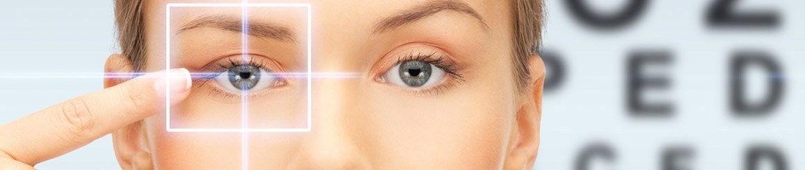 A woman's face with a targeting frame drawn over one eye and a blurred eye chart behind her.